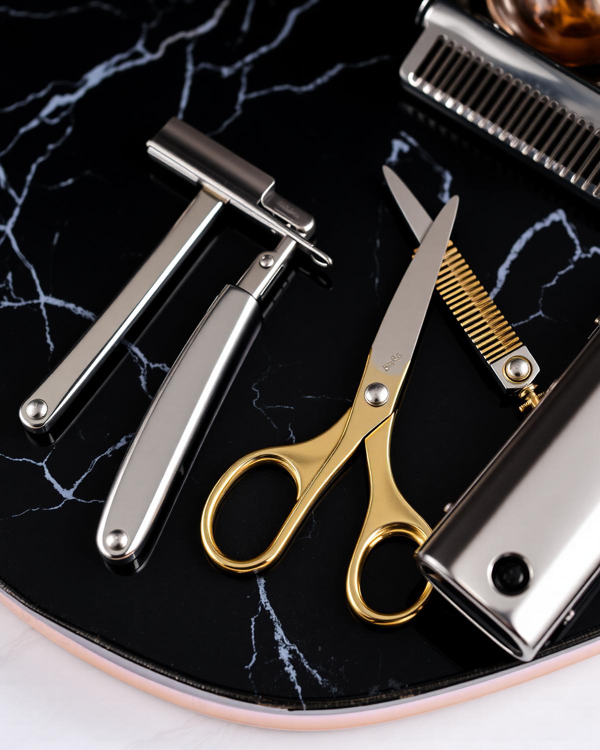 Premium barber tools on black marble